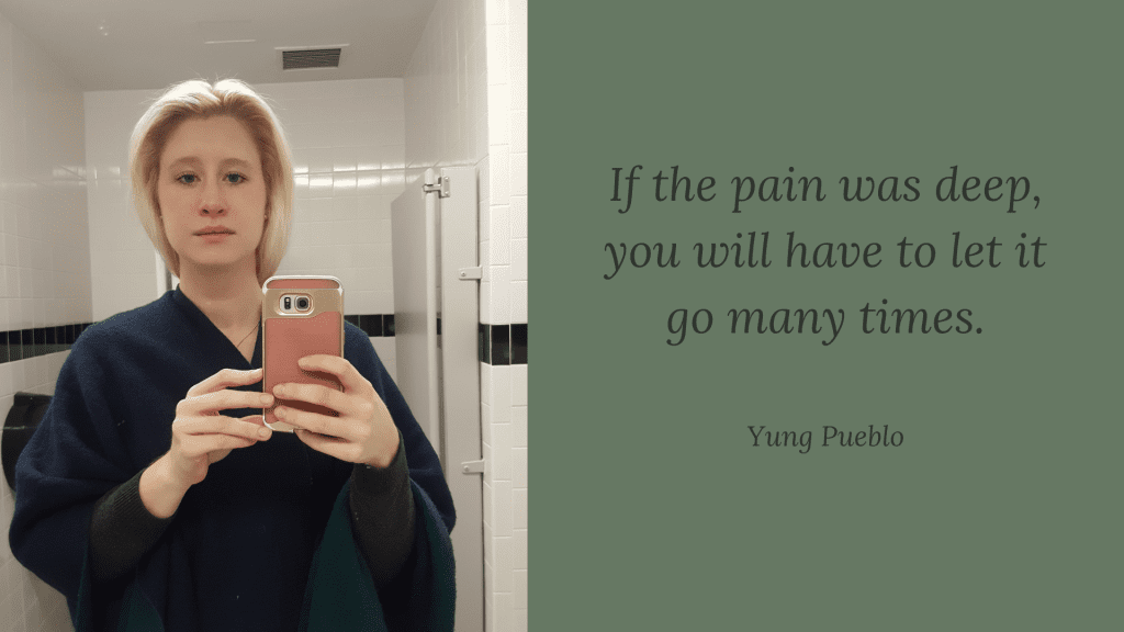Selfie of author after crying in the bathroom with a quote by Yung Pueblo next to it.